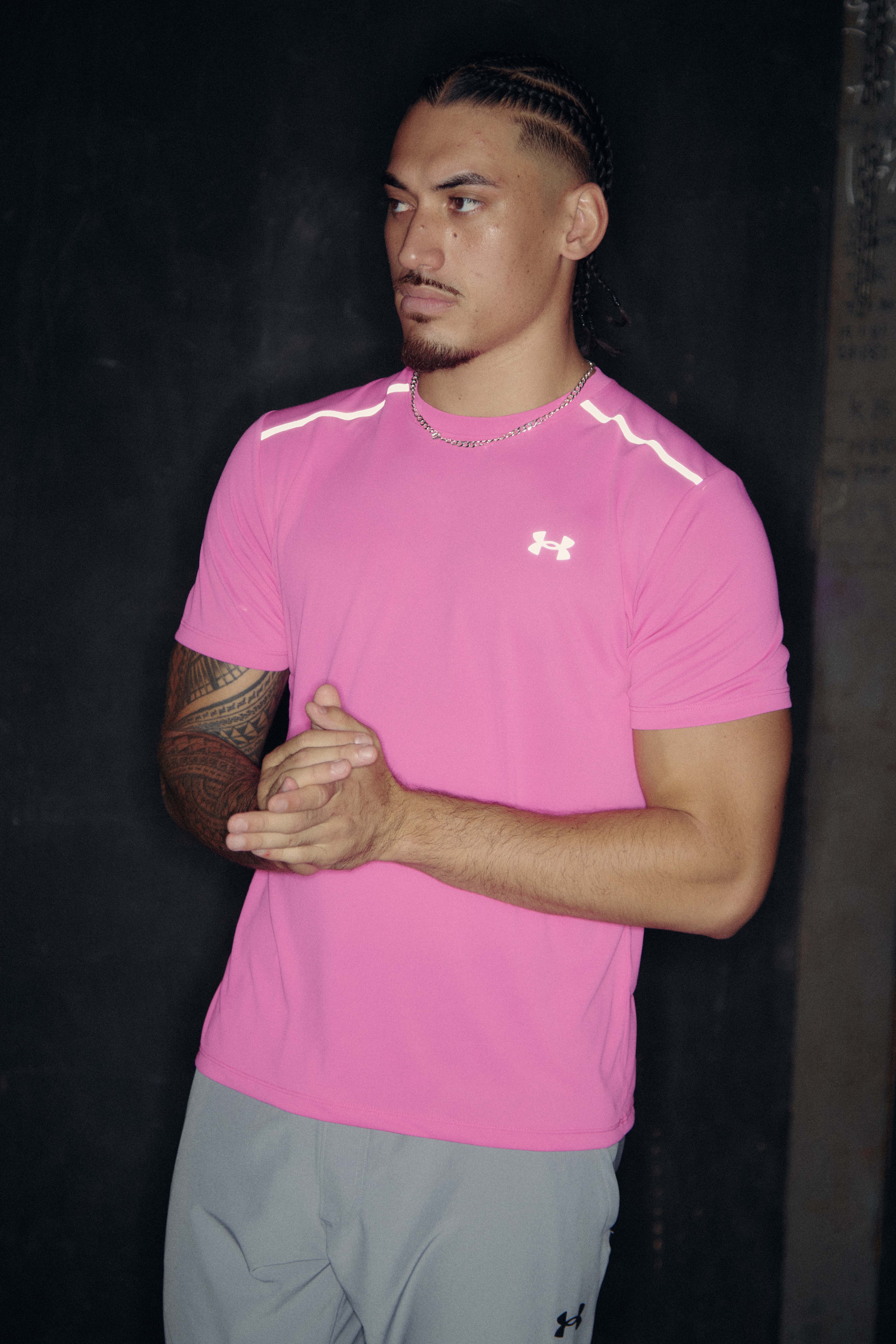 Man wearing pink Under Armour shirt