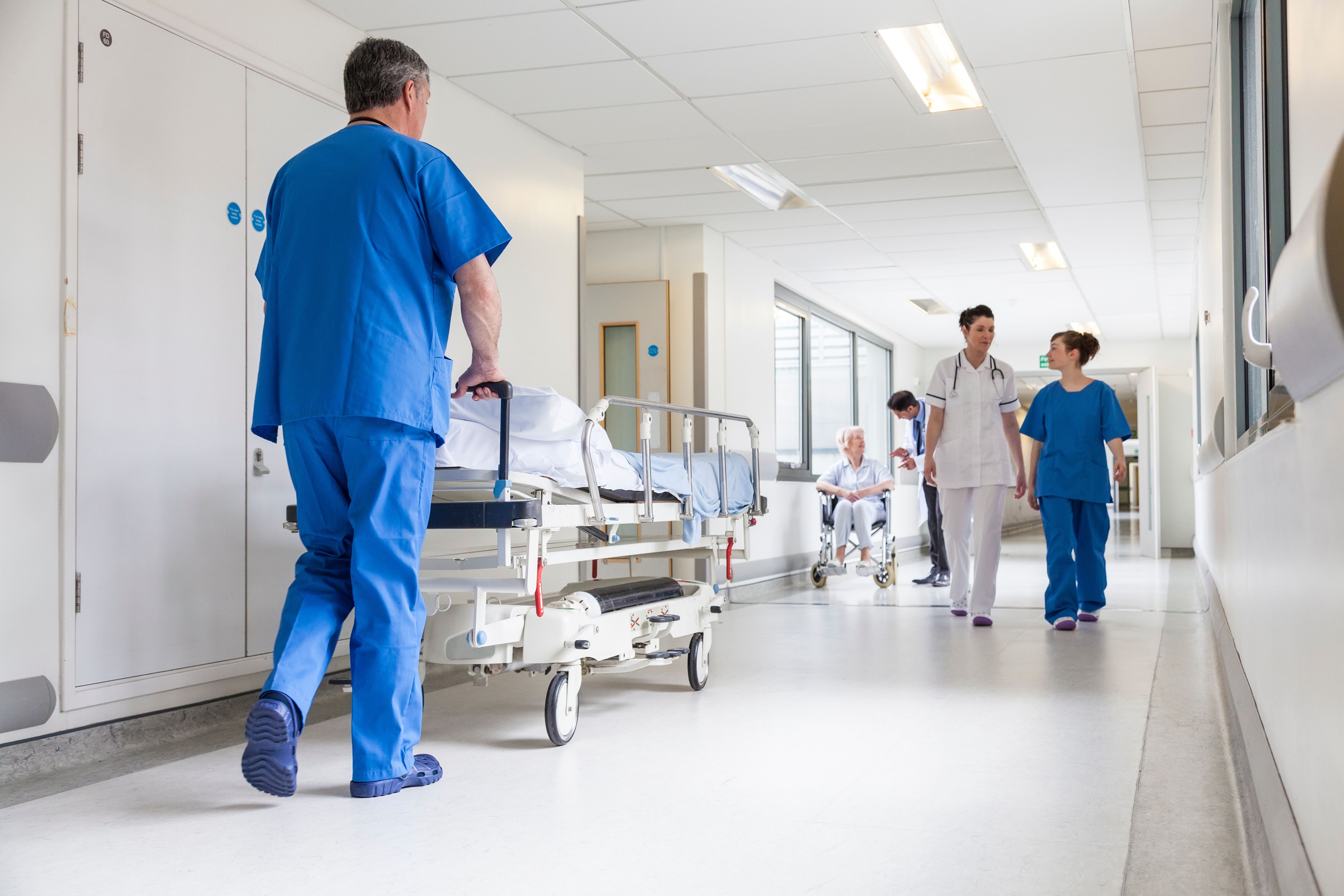 Doctors and nurses in hospital corridor