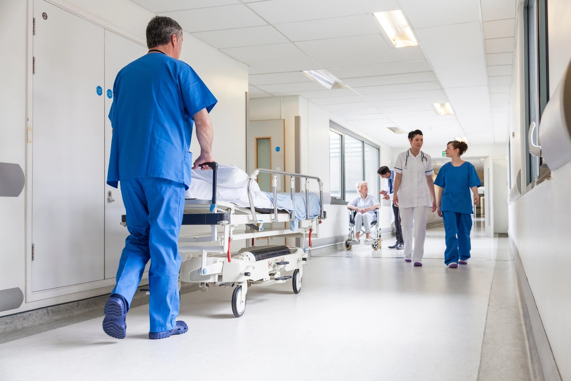 Doctors and nurses in hospital corridor