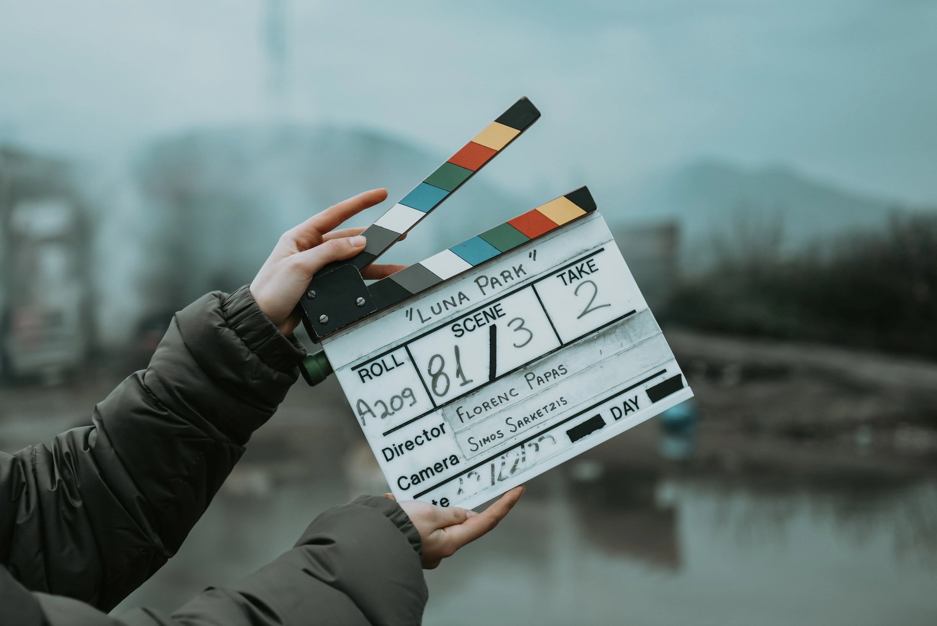 Close-up of a film clapperboard on an outdoor set, signaling scene start