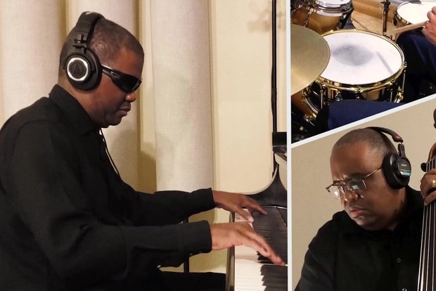 Jazz musician Marcus Roberts playing piano with headphones on, alongside smaller frames showing fellow musicians recording remotely.