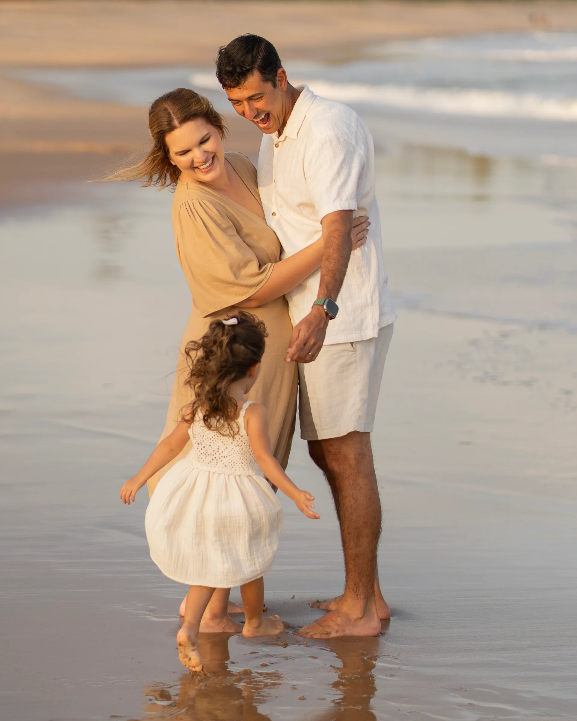 Family enjoying a quiet moment together by the sea 