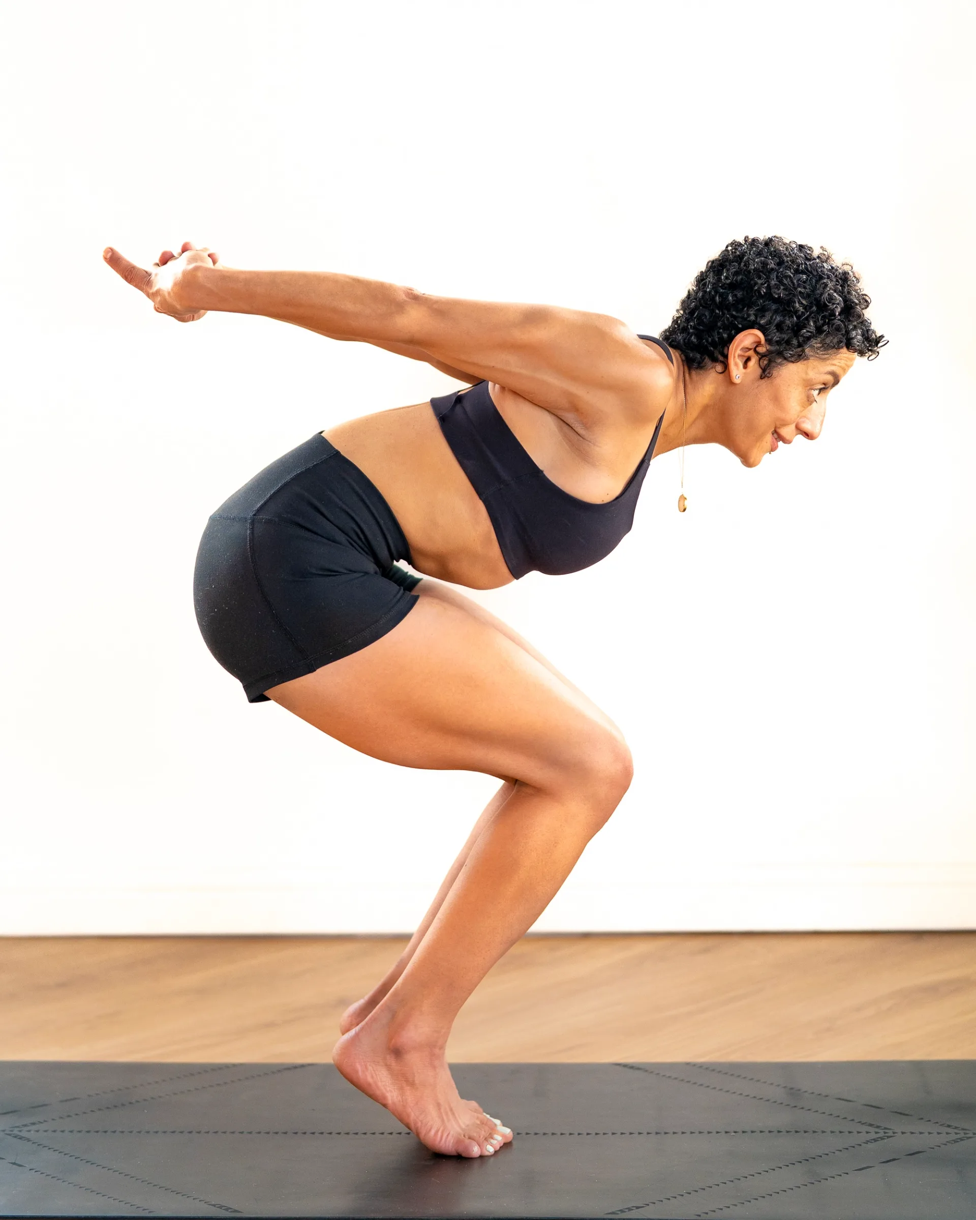 A yogini teacher holding a beautiful pose at the studio