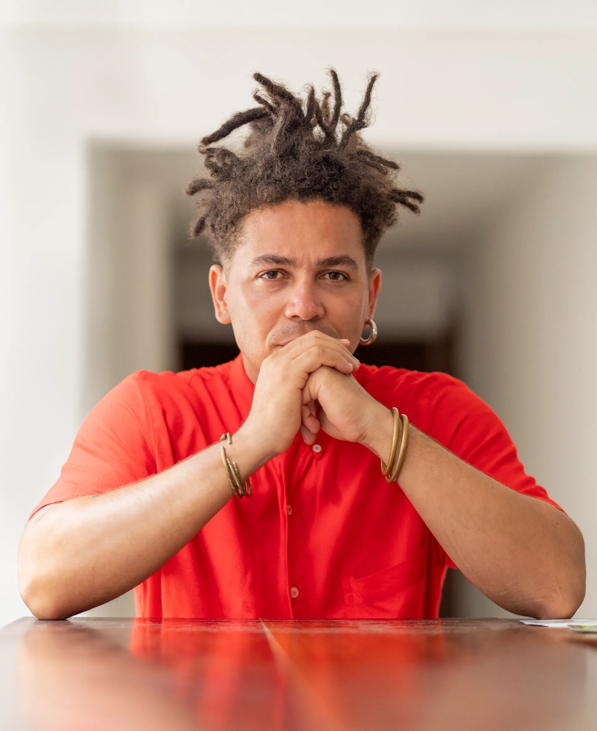 Singer branding portrait, seated with a confident and thoughtful expression 