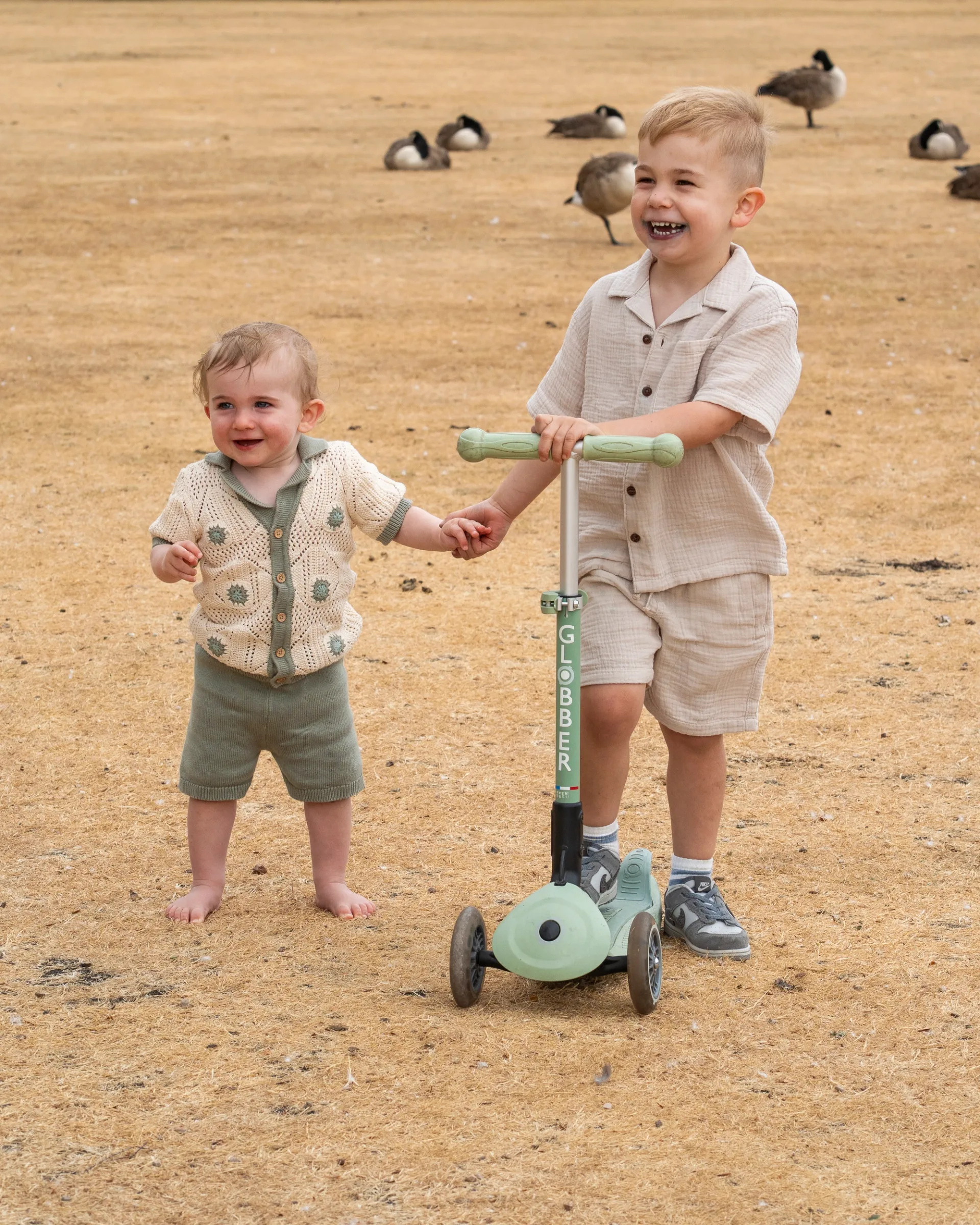 Little boys playing outside in the garden