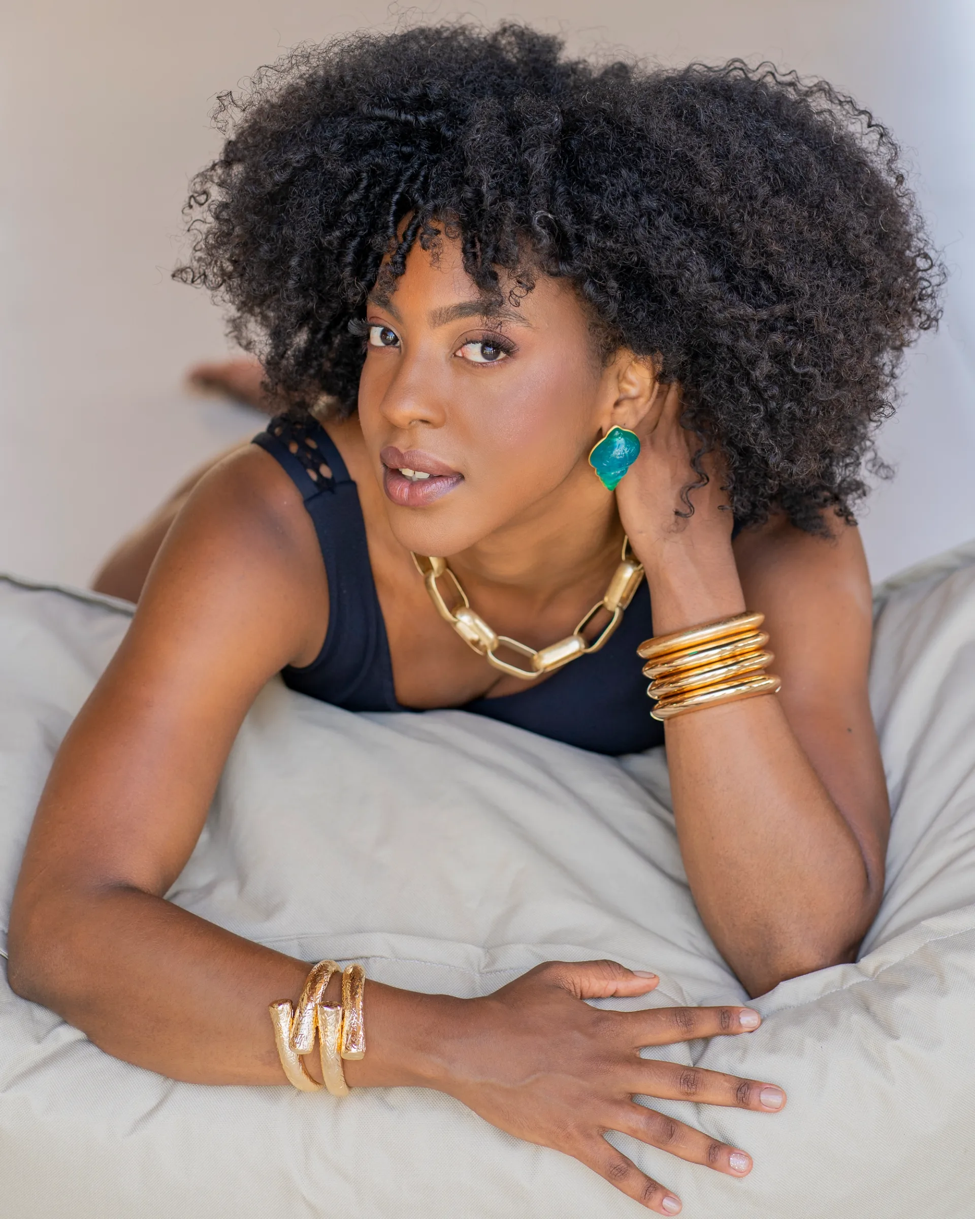 Branding portrait with natural curls.. statement jewellery and a confident, effortless feel