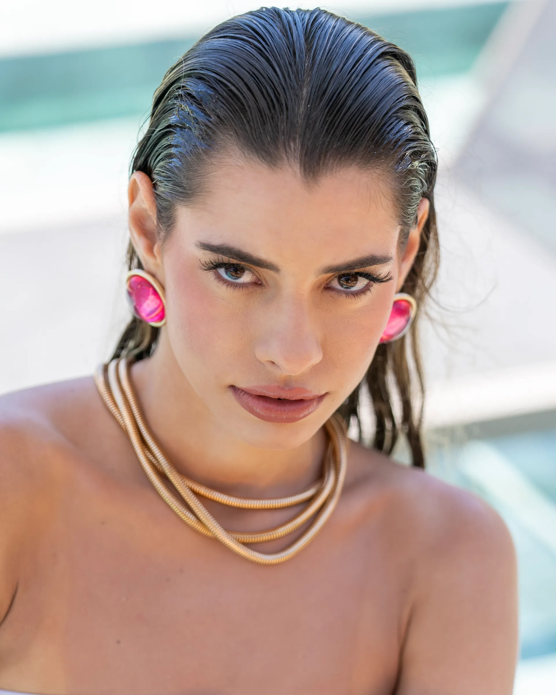 Beautiful woman posing by the pool 