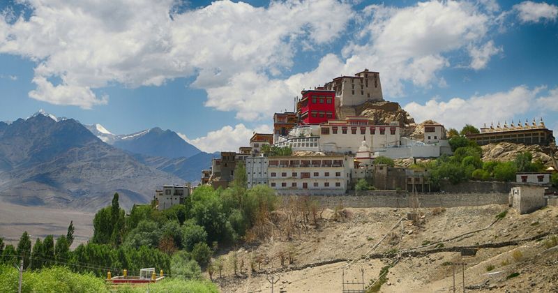 Thiksey Monastery from the Indus Valley floor — the 12-storey Buddhist monastery resembling Tibet's Potala Palace sits 19 kilometres from Leh; entry ₹30–₹50, and the morning prayer ceremony at 6–7am is the most authentic experience in central Ladakh