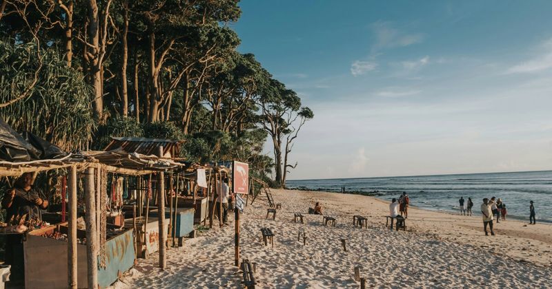 Neil Island (Shaheed Dweep) in the Andaman Islands — the smaller, quieter island 20 kilometres from Havelock has fewer resorts and better west-facing sunsets; ferry from Havelock ₹950–₁,500, 1–1.5 hours; the Natural Bridge rock formation is Neil's most photographed landmark at low tide
