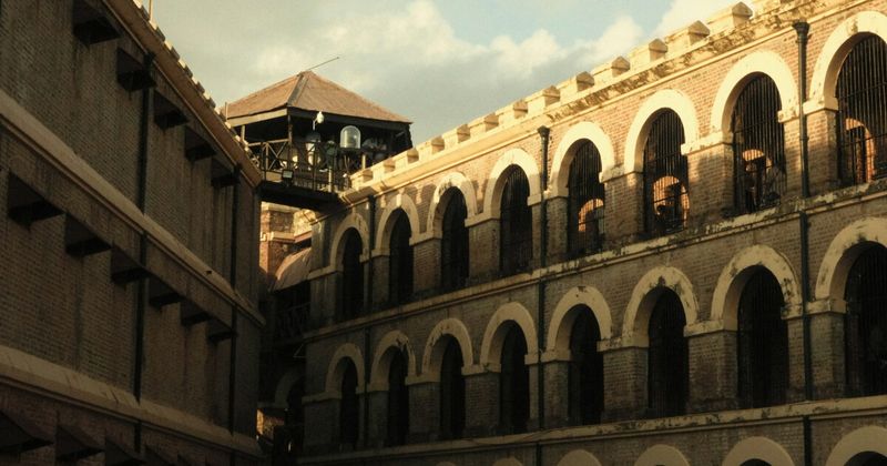 The Cellular Jail (Kala Pani) in Port Blair, Andaman Islands — the British colonial panopticon prison built 1896–1906 housed India's freedom fighters in 693 individual cells; three of the original seven radial wings survive; Light & Sound Show ₹300 adults, English show Mondays/Wednesdays/Fridays at 6:50pm
