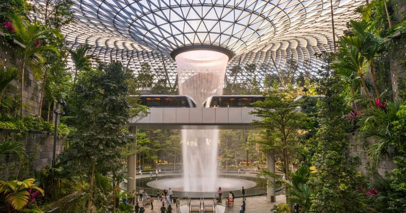 After Singapore section Alt text: Mumbai to Singapore flights 2026 — Singapore Changi Airport interior nonstop in 4h 30m from ₹22,000 return July