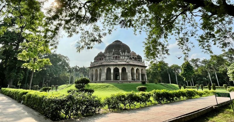 A 15th-century Sayyid dynasty tomb in Lodhi Garden, Delhi — the 90-acre public park contains multiple medieval Mughal tombs set among flowerbeds and jogging paths; free entry from 6am, and one of the most quietly surreal public spaces in any major city in the world