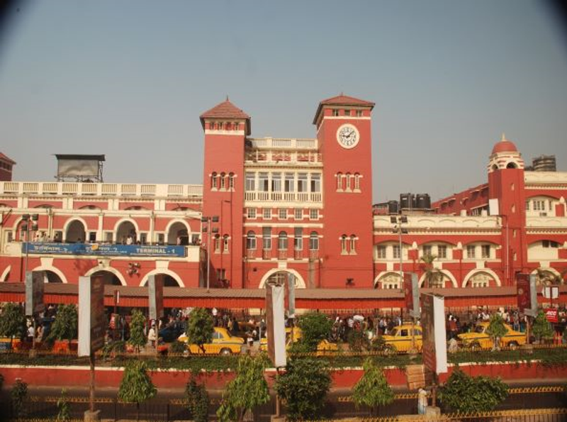 Howrah station, Kolkata — India's largest railway station by platforms; the Delhi–Howrah Rajdhani arrives here at dawn after 17–18 hours across the Gangetic plains.