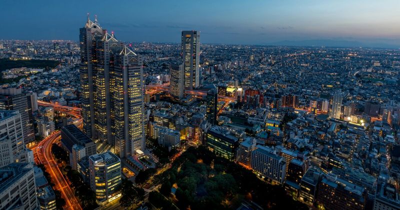 India to Japan flights 2026 — Tokyo Shinjuku night aerial for Indian travellers direct routes layover price comparison.