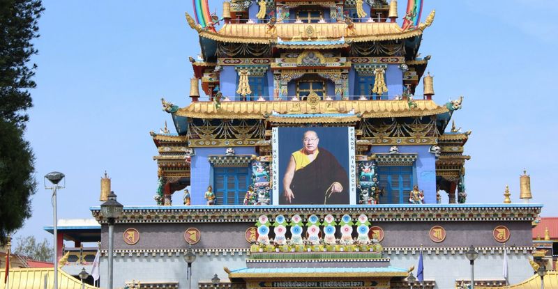 Namdroling Monastery in Bylakuppe — India's largest Tibetan settlement; the Golden Temple's 18-metre statues are among the tallest gilded Buddha figures in Asia; free entry.