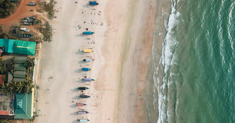 Aerial view of Goa's coastline from descending aircraft — IndiGo and Akasa Air are the main budget carriers on the Mumbai to Goa route, with fares starting from ₹2,400 on weekdays booked in advance