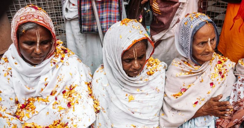 Phoolon Wali Holi (Flower Holi) at Banke Bihari Temple in Vrindavan — priests shower devotees with fresh marigold and rose petals rather than gulal powder; occurs approximately 7 days before the main Holi date; lasts about 30 minutes; arrive early for a position near the temple entrance