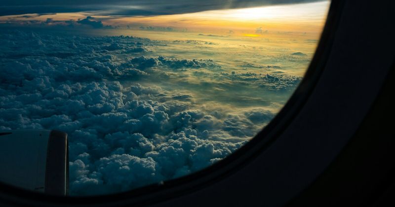 Long haul flight from Newark EWR to India over clouds — United Airlines nonstop route 2026