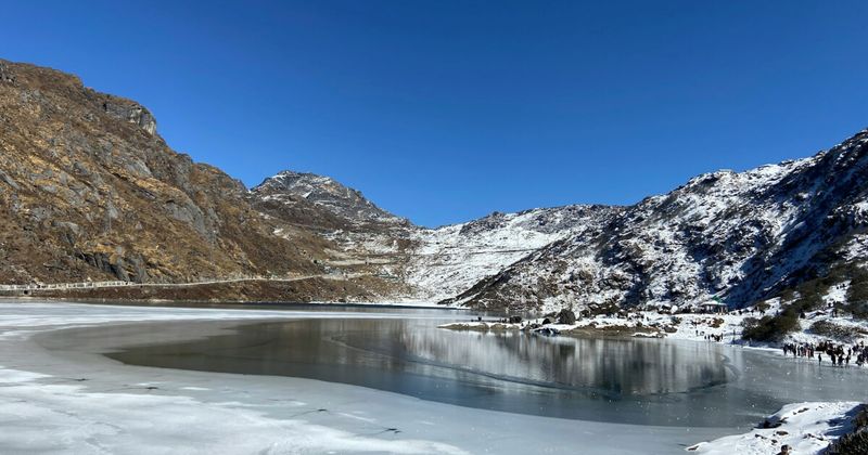 Tsomgo (Changu) Lake in East Sikkim at 3,753m — foreigners require RAP + PAP to visit; minimum 2 foreign nationals; tour operator arranges permits (₹800–1,000/person in shared vehicle); foreigners permitted to Tsomgo/Baba Mandir only — Nathula Pass is restricted