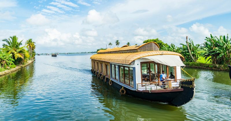 Traditional wooden houseboat on Alleppey Kerala backwaters — India 3 weeks itinerary South India Kerala
