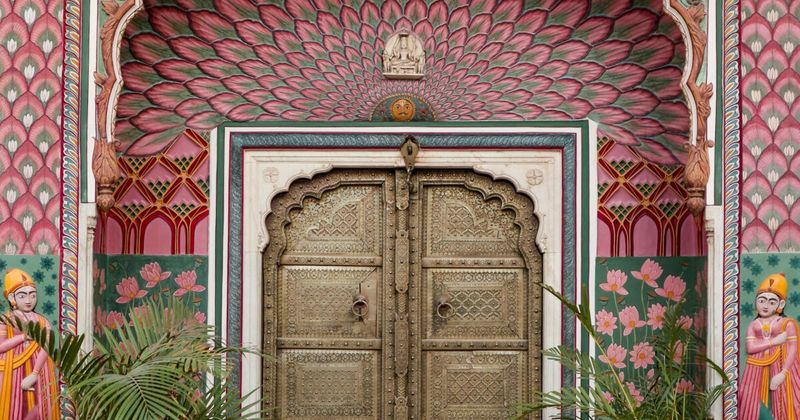 The Mor Chowk (Peacock Courtyard) inside the City Palace Udaipur — the glass mosaic peacocks in blue, green, and gold covering the walls of the private royal courtyard are considered the finest example of glass mosaic work in Rajasthan; City Palace foreigner entry ₹300, open 9:30am–5:30pm