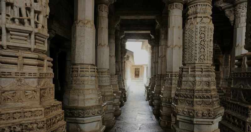 The 1,444 carved marble pillars of Ranakpur Jain Temple — completed in 1458 after 50 years of construction; no two pillars are identical; entry free for all visitors; non-Jain visitors 12pm–5pm; cover shoulders and knees, no leather items permitted