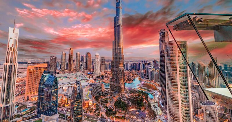 Mumbai to Dubai flights 2026 — aerial view of Dubai skyline for Indian travellers comparing Emirates Air India IndiGo fares
