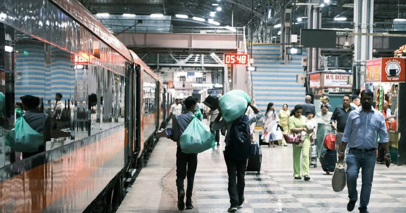 Busy Mumbai Central railway station platform with commuters — India train travel guide for first-time visitors