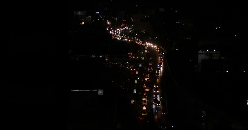 Indian city road at night — airport transfers Delhi Mumbai Kochi Chennai arrival 2026