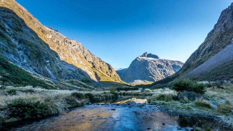 New Zealand Queenstown Lake Wakatipu aerial — best Indian city gateway to NZ 2026 Auckland Christchurch Wellington comparison.