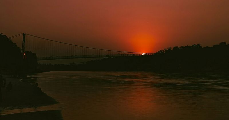 Laxman Jhula suspension bridge Rishikesh at night over Ganges River