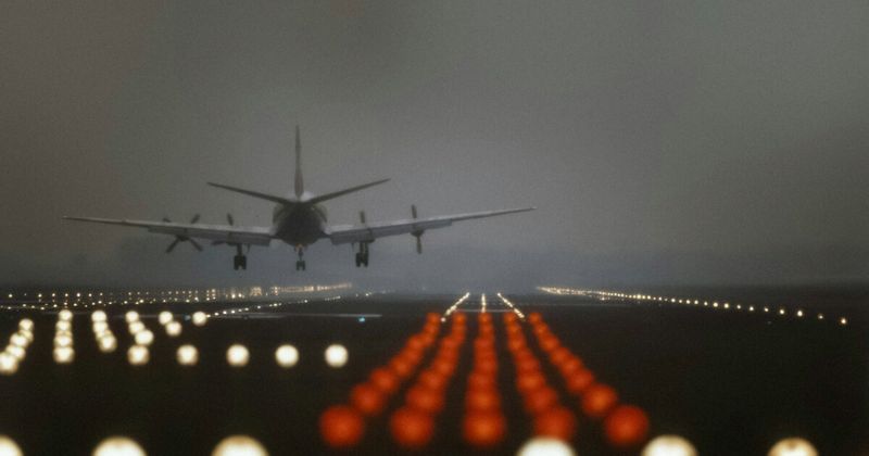 Airport runway night — polar routing fastest USA to India flight 2026 EWR Delhi nonstop.