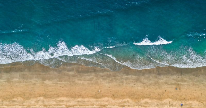Empty Agonda Beach in South Goa at low tide — one of the quietest stretches of sand in Goa and a seasonal nesting site for Olive Ridley sea turtles