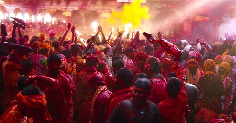 Holi in India — the Festival of Colours covers participants in gulal powder in shades of magenta, yellow, orange, and green; the main Holi day 2027 is March 3; Vrindavan and Barsana begin celebrations 7–10 days earlier with the Phoolon Wali and Lathmar Holi