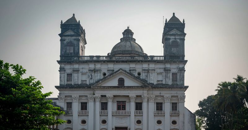 Exterior facade of the Basilica of Bom Jesus in Old Goa — a 17th-century UNESCO World Heritage church and the anchor of Goa's Portuguese heritage circuit