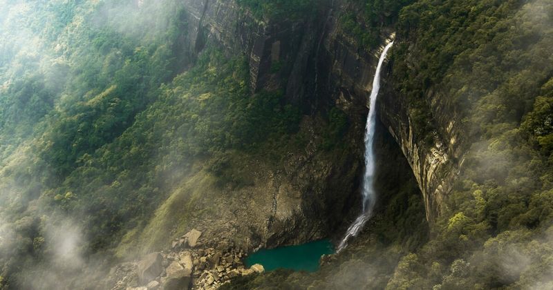 Dense jungle fog over forest-covered hills in Northeast India — Meghalaya travel guide for foreign tourists