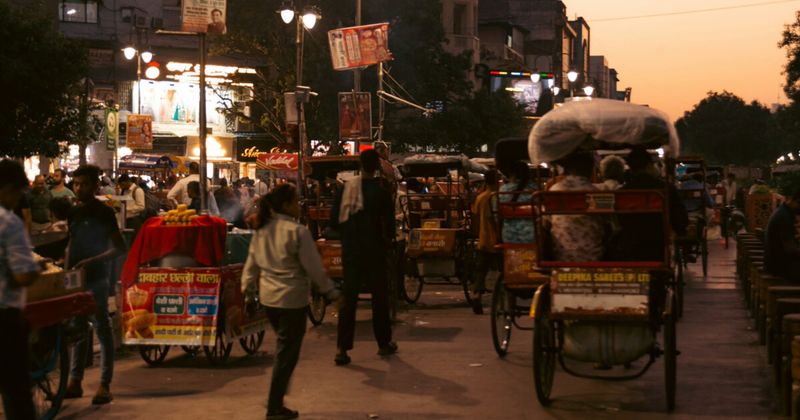Busy Indian street scene with crowds and vehicles — India tourist attraction scams to avoid 2026
