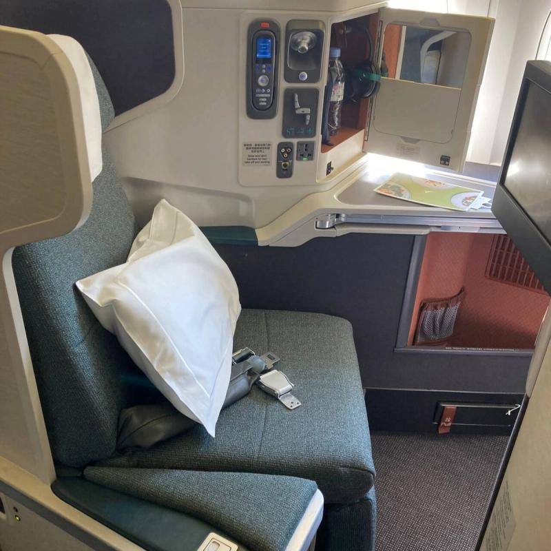 Business class comparison IndiGo Air India Emirates international flights 2026 lie flat suite cabin.
