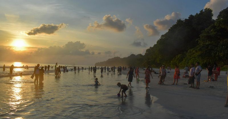 Sunset over the Andaman Sea — the islands are 1,300 kilometres from mainland India and 150 kilometres from the nearest coast of Myanmar; the geographical isolation produces the specific qualities of light and colour visible at sunset that are absent from any Indian mainland beach