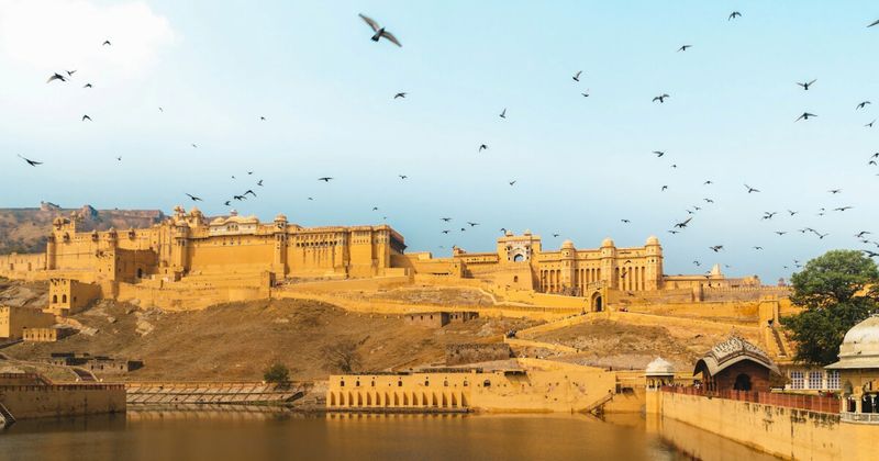 Amber Fort in Jaipur, Rajasthan, at golden hour — the UNESCO World Heritage Site is the centrepiece of the Golden Triangle circuit and the most photogenic fort in North India, best visited at 8am opening before the tour coaches arrive
