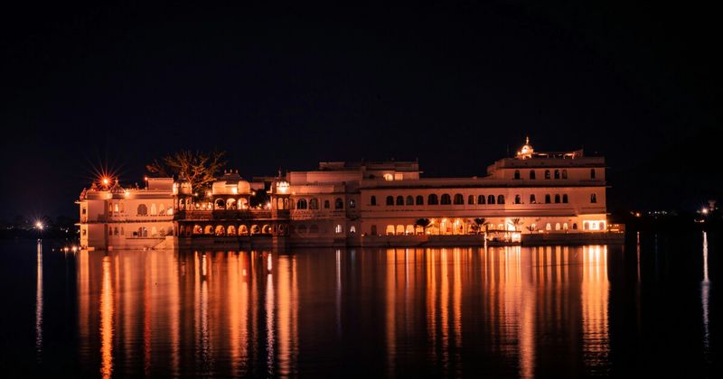 Taj Lake Palace Udaipur reflected in Lake Pichola at night — India 3 weeks Rajasthan itinerary