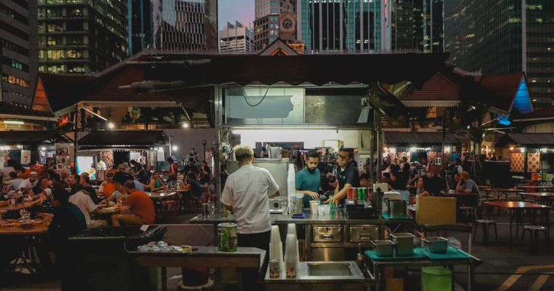 Singapore hawker centre — one of the food experiences accessible from Delhi on nonstop flights from ₹22,000 return in July 2026