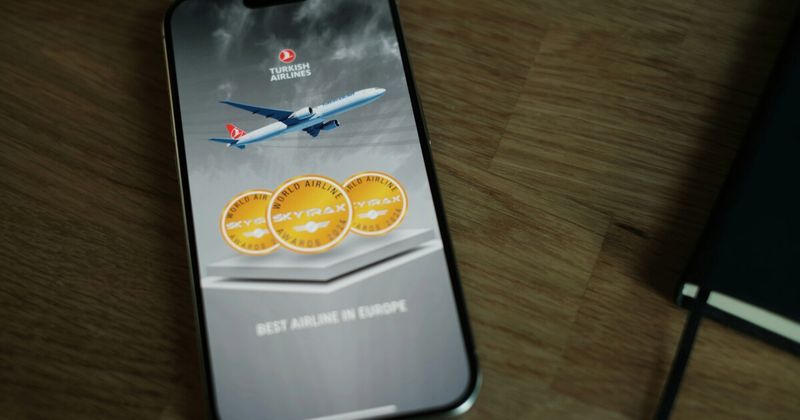 Flight booking confirmation on smartphone — booking USA to India flights under $700 step by step 2026