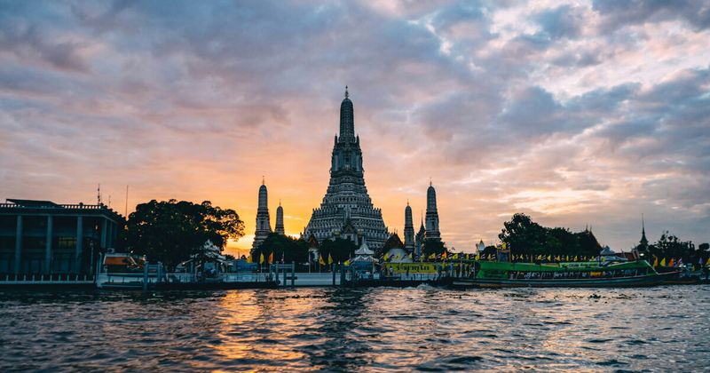 Kolkata to Bangkok cheapest flights East India 2026 — Bangkok Wat Arun temple aerial sunset CCU BKK nonstop 2h 35m.