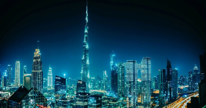 Mumbai to Dubai return flights 2026 — Dubai skyline aerial view cheapest month September from ₹24,000