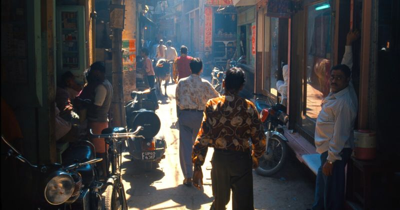 A narrow gali behind the Varanasi ghats — the lanes behind the riverfront are the city's actual circulatory system, connecting the ghats to the temples, markets, and residential quarters; they are also completely impossible to navigate without getting thoroughly lost, which is the correct way to experience them