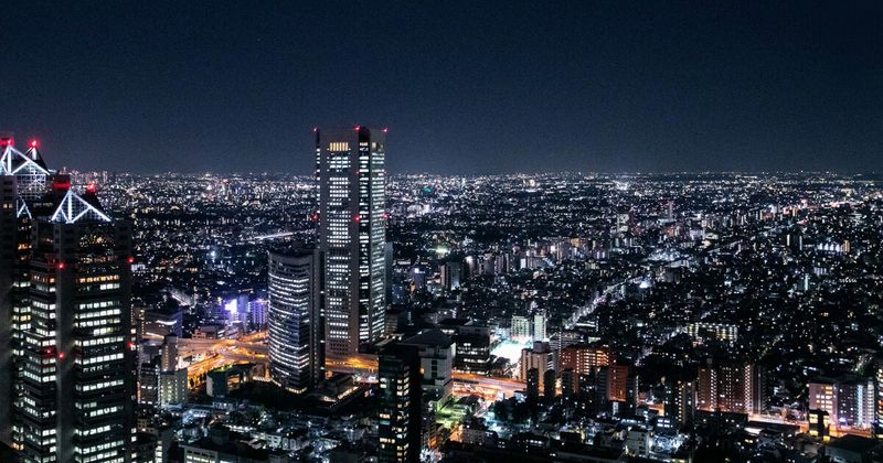 Tokyo Japan city skyline at night — Japan to India flights 2026 Tokyo Narita Haneda airport guide.