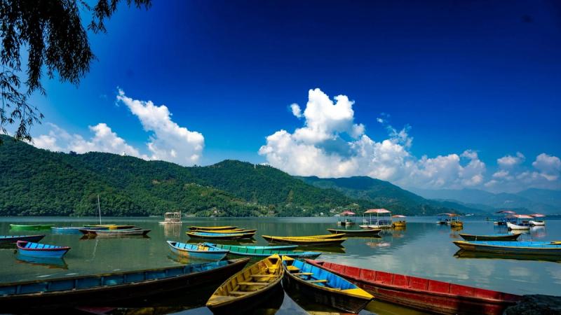 Nepal Pokhara Phewa Lake boat mountain view — international trip under ₹20000 from India by land route Gorakhpur 2026.