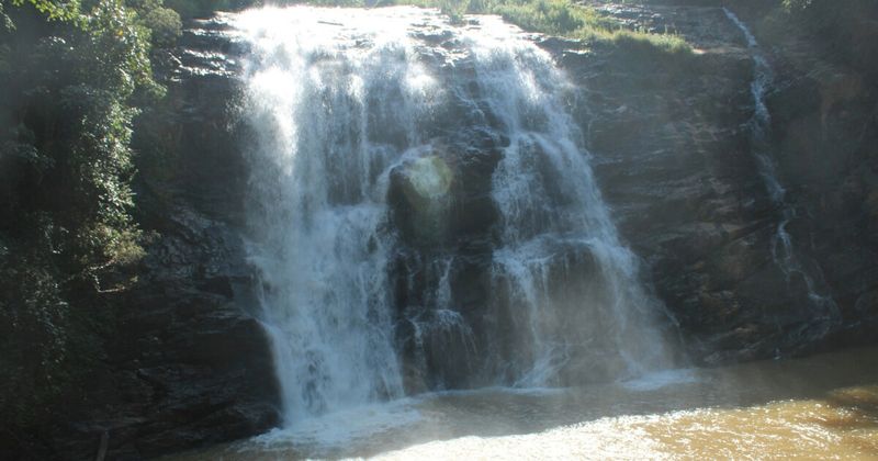 Abbey Falls in Coorg — 70m waterfall surrounded by coffee and cardamom estates; entry ₹10–20; visit on weekdays to avoid queues.