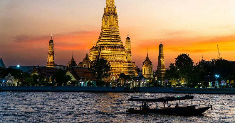 Mumbai to Bangkok cheapest flights 2026 — Bangkok Wat Arun temple aerial view reachable on Thai Lion Air BOM-DMK nonstop